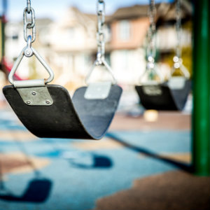 closeup of playground swing